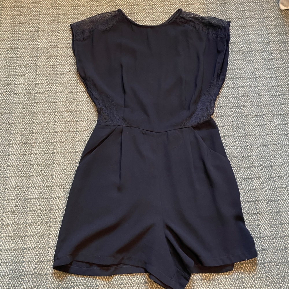 Black Sleeveless Romper with Lace Cutouts